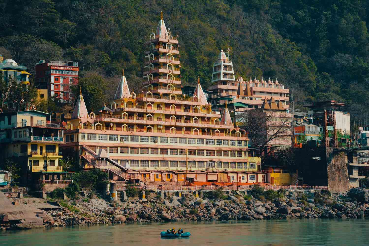 Peaceful Ganges River flowing through Rishikesh, Uttarakhand with temples and suspension bridges in the Himalayan foothills